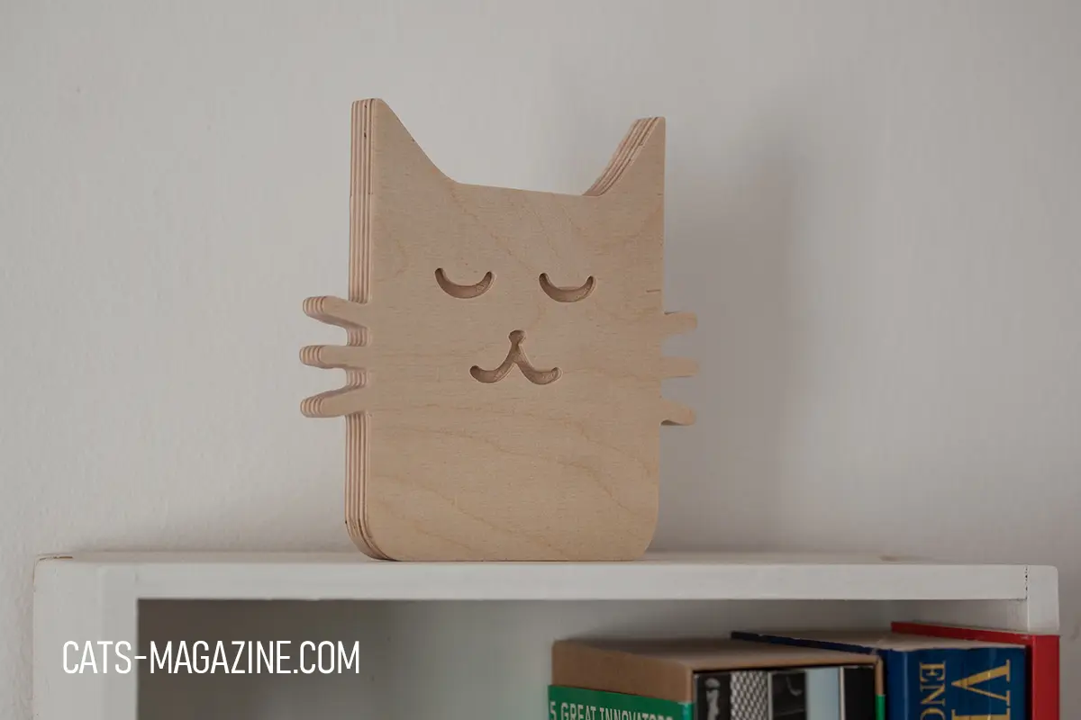 Handmade Zen Cat wooden decor with closed eyes, created for the Cats Magazine shop