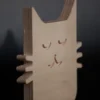 Plywood cat decor layered wood detail Side detail of handmade plywood cat showing layered construction