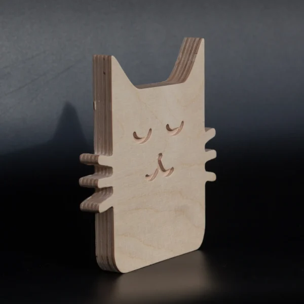 Minimalist wooden cat decor angled view Angled view of small minimalist plywood cat decor