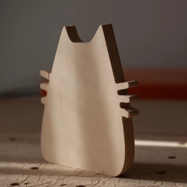 Plywood cat decor side and back detail Side and back view of handmade plywood cat decor showing layered construction