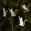 Zen Cat Wooden Ornaments – Set of 5 on Evergreen Branch Set of five minimalist wooden cat ornaments hanging on an evergreen tree branch